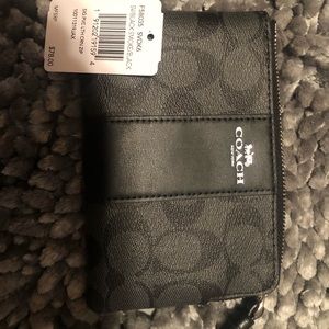 black Coach wristlet nwt and care instructions